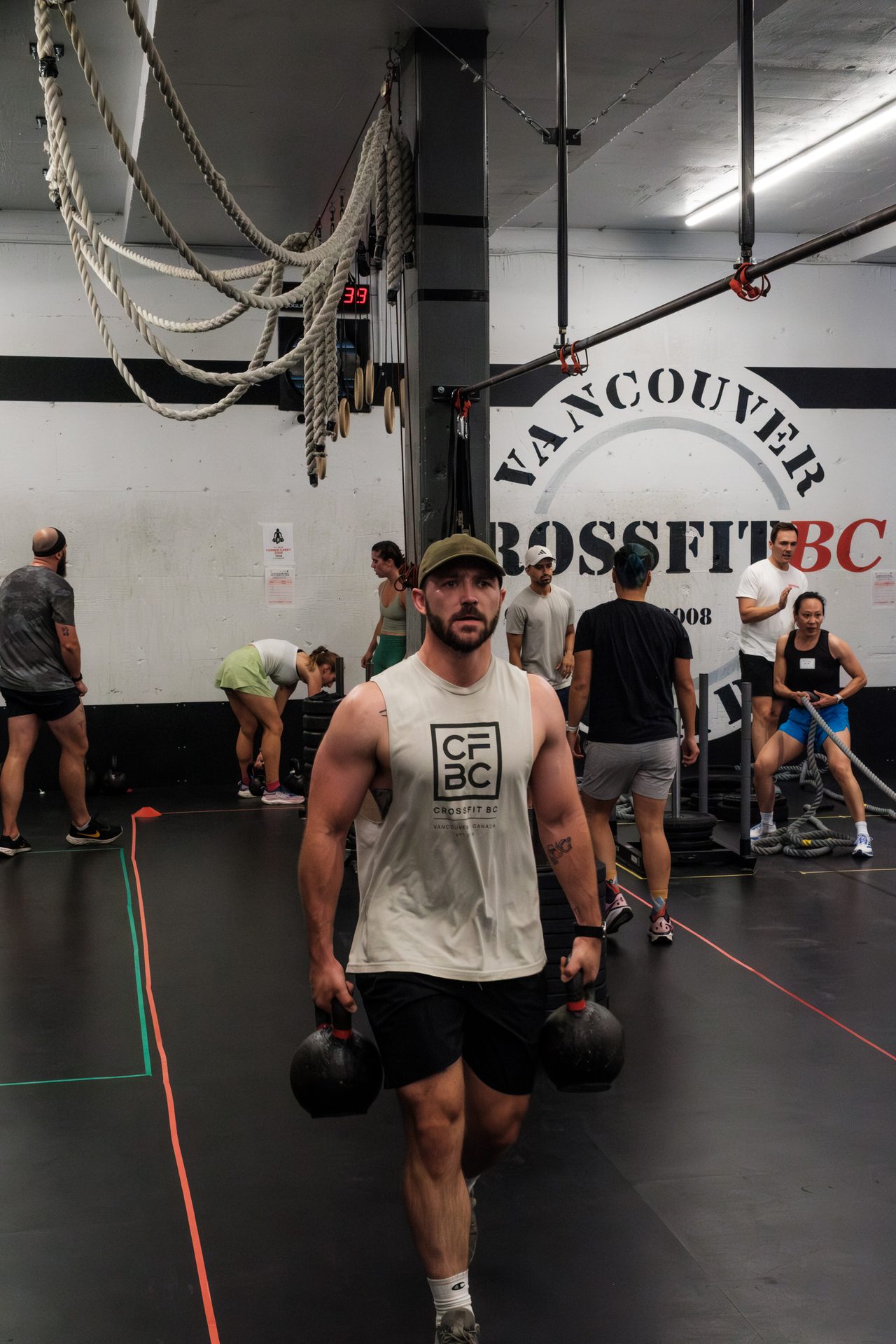Athletes grinding through a workout station